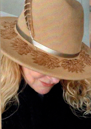 Cheri wearing a decorated hat